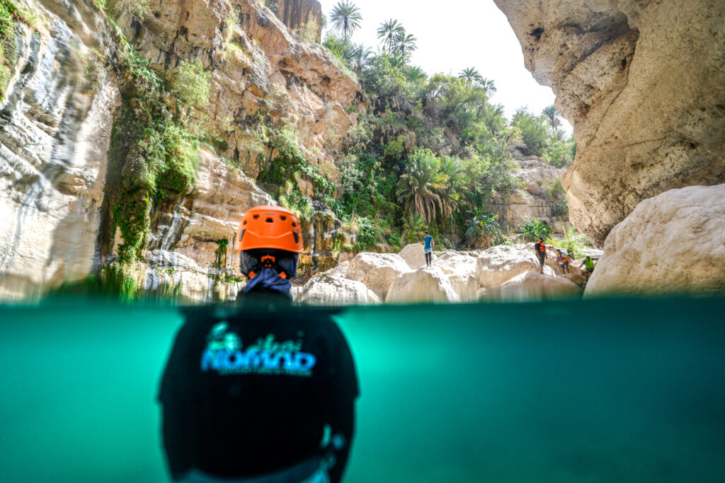 Tourists enjoying Wadi Mibam adventure with Nomad Adventures in Oman